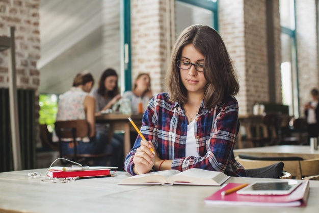 charming brunette studying alone 23 2147656011