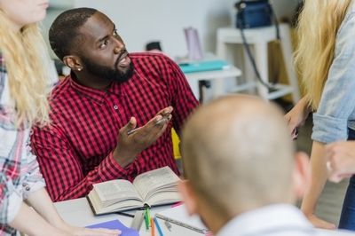 “Many heads are greater than one….but only if all of them are actively working to identify and solve the problem.” students talking and arguing